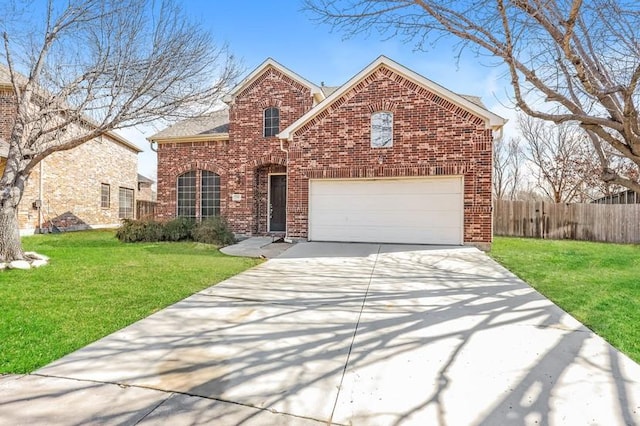 traditional home with a garage, fence, a front lawn, and brick siding