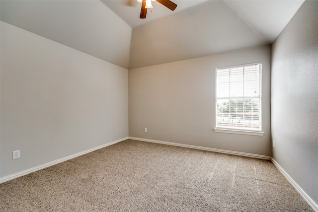 unfurnished room featuring carpet flooring, vaulted ceiling, and ceiling fan