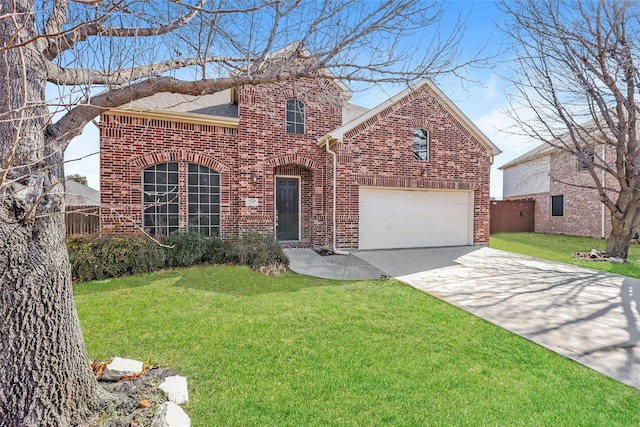 traditional-style home with a shingled roof, a front yard, brick siding, and driveway