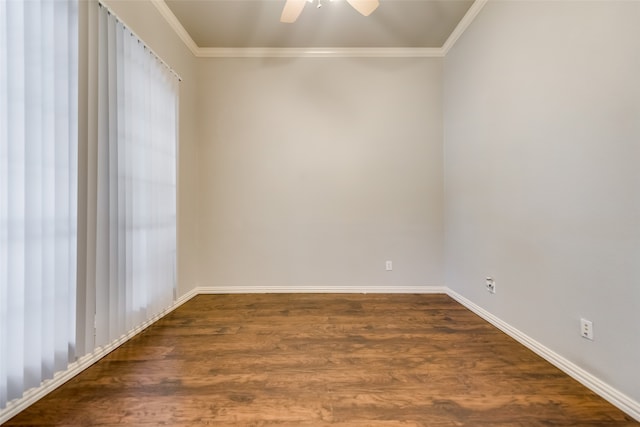 empty room featuring dark hardwood / wood-style floors, ceiling fan, and ornamental molding