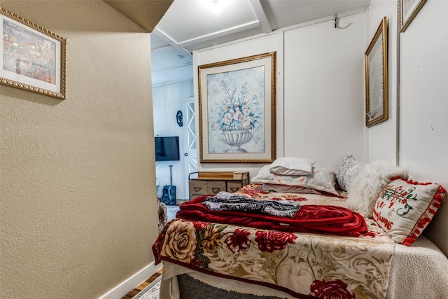 bedroom with hardwood / wood-style floors