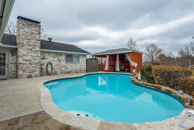 view of pool featuring a patio