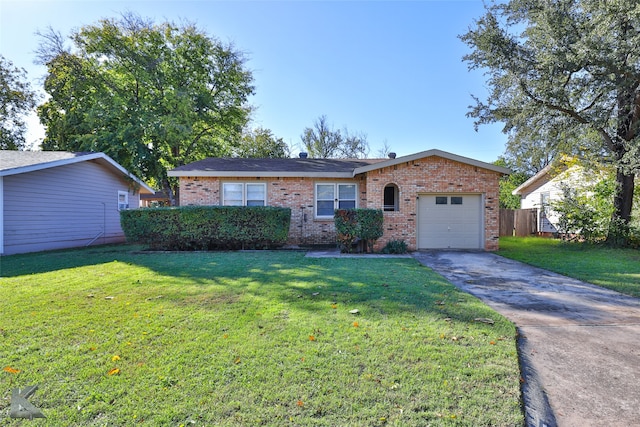 ranch-style house featuring a front yard and a garage