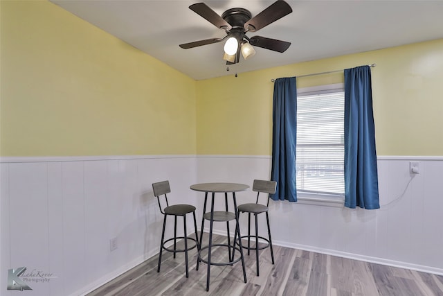 dining room with light hardwood / wood-style flooring and ceiling fan