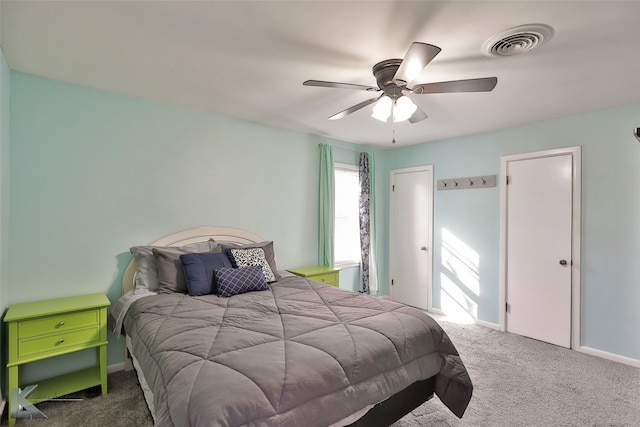 carpeted bedroom with ceiling fan