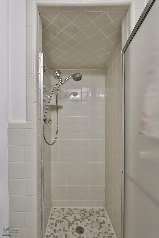 bathroom featuring an enclosed shower