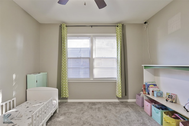 bedroom featuring light carpet and ceiling fan