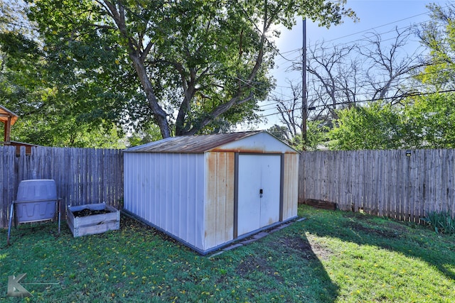 view of outdoor structure with a lawn