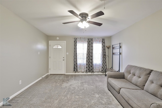 unfurnished living room featuring carpet and ceiling fan