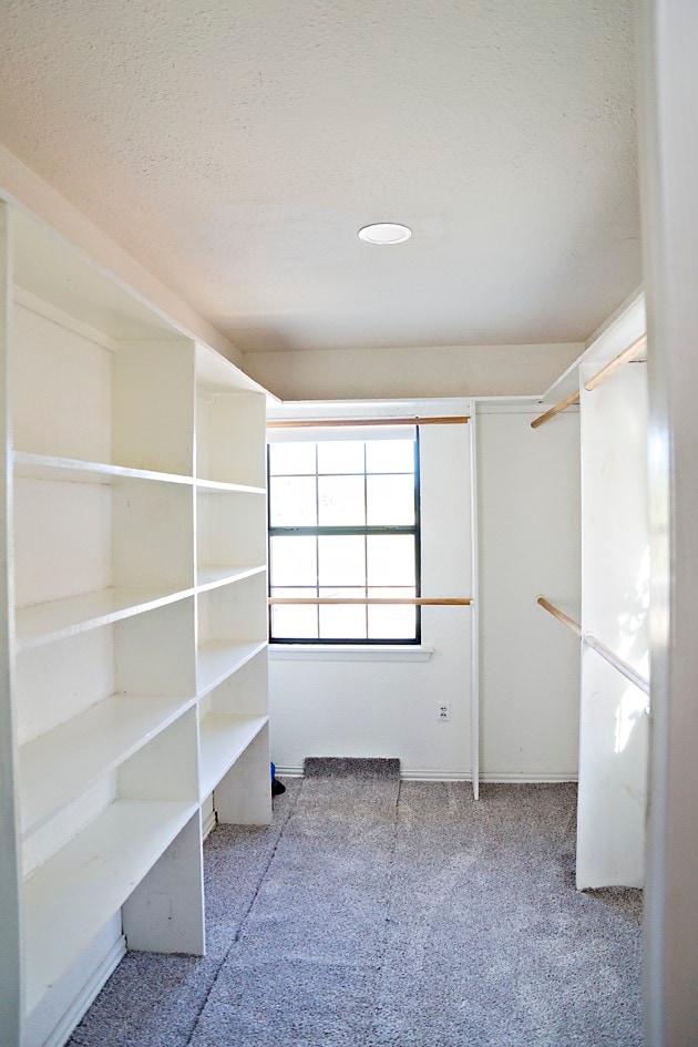 spacious closet featuring light carpet