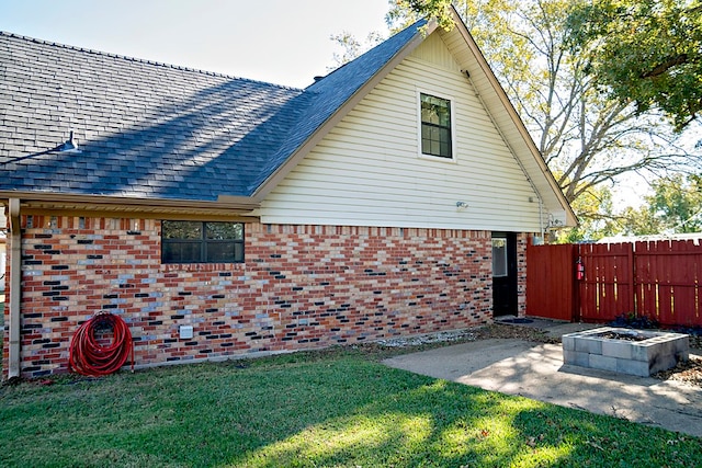 view of home's exterior featuring a patio area and a yard