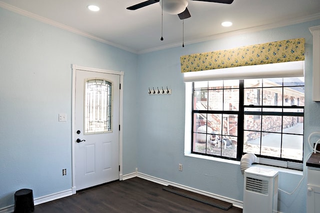 foyer entrance with ceiling fan, dark hardwood / wood-style flooring, and ornamental molding