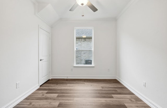 unfurnished room featuring hardwood / wood-style floors, ceiling fan, and crown molding