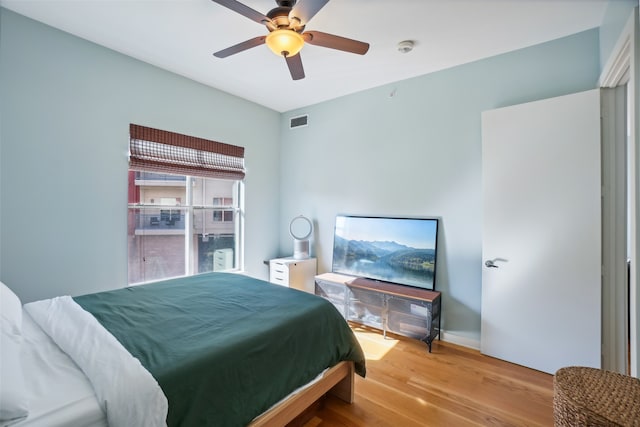 bedroom featuring wood-type flooring and ceiling fan