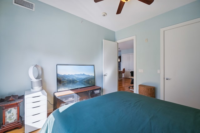 bedroom featuring wood-type flooring and ceiling fan