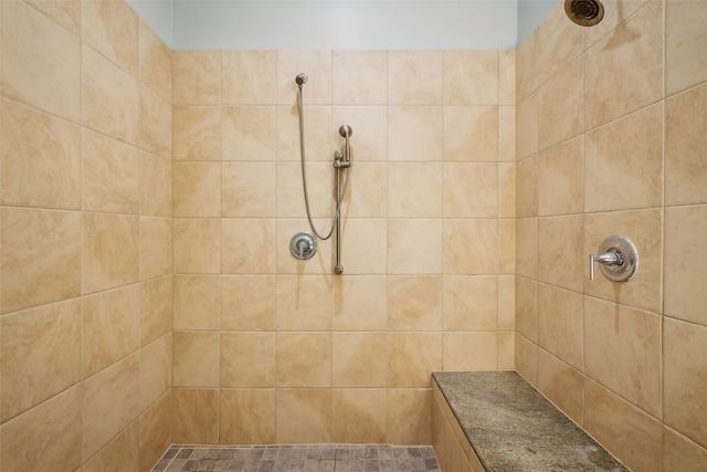 bathroom featuring tiled shower