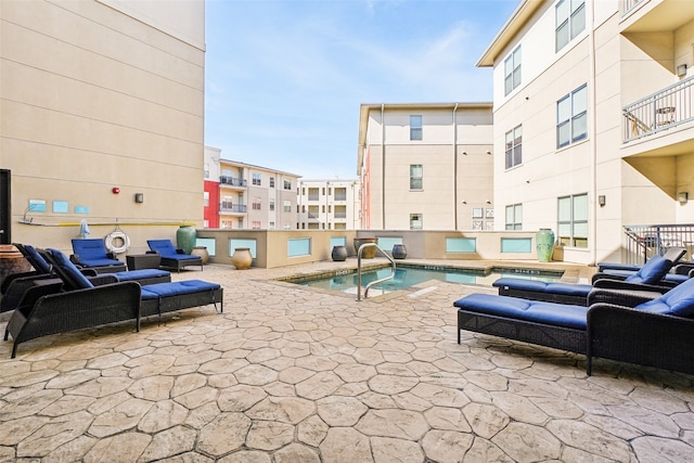 view of patio / terrace featuring a community pool