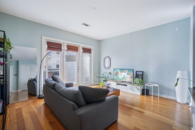 living room with light hardwood / wood-style floors