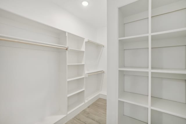 walk in closet featuring light hardwood / wood-style floors