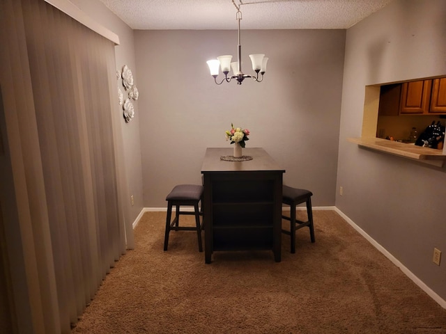 carpeted dining room with a textured ceiling and an inviting chandelier