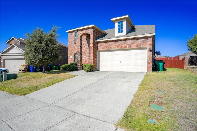 view of front of house with a front lawn and a garage