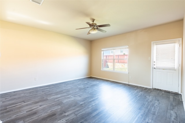 empty room featuring ceiling fan and dark hardwood / wood-style flooring