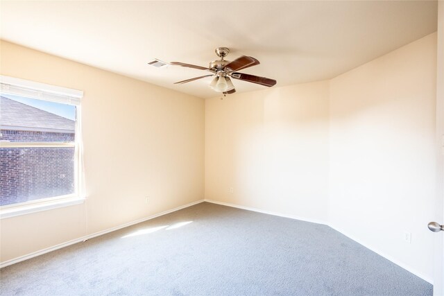 carpeted empty room with ceiling fan