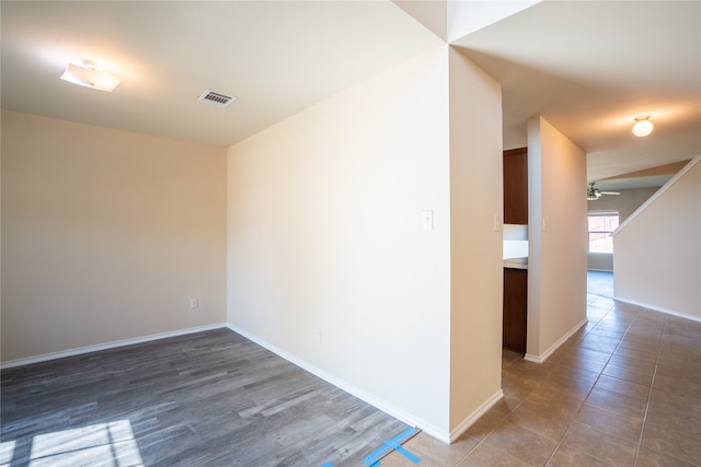 unfurnished room featuring dark hardwood / wood-style floors and ceiling fan