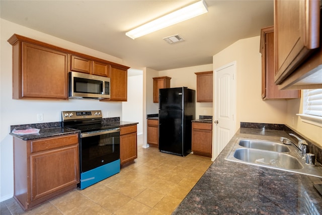 kitchen with sink and appliances with stainless steel finishes