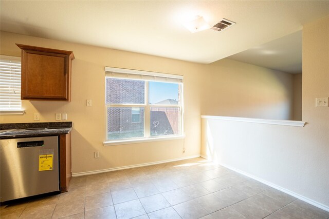 kitchen with dishwasher and light tile patterned flooring