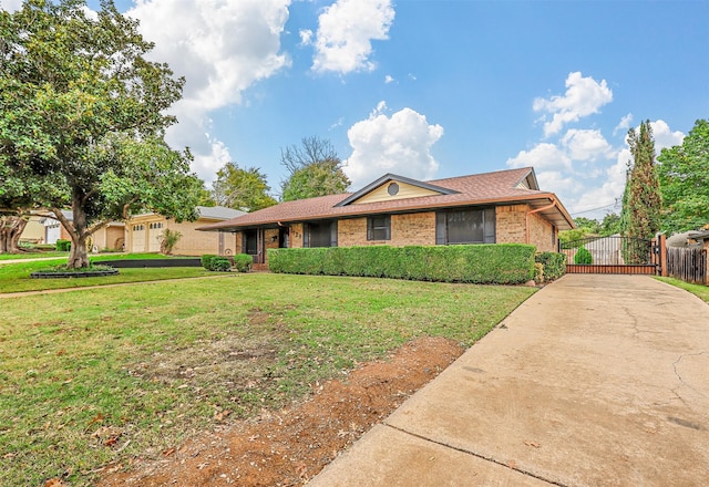 ranch-style home with a front yard