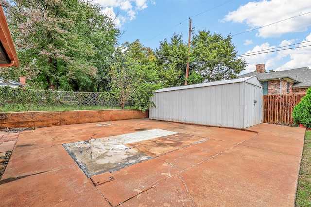 view of patio / terrace featuring a storage unit