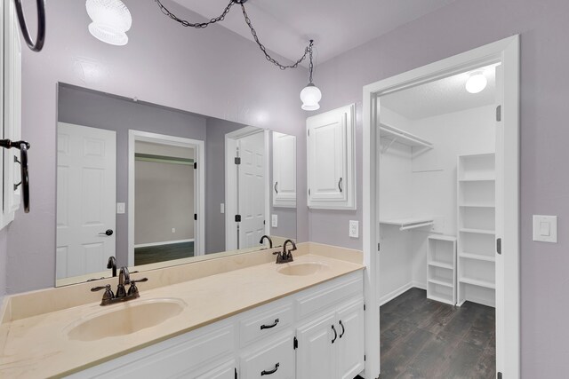 bathroom with vanity and wood-type flooring