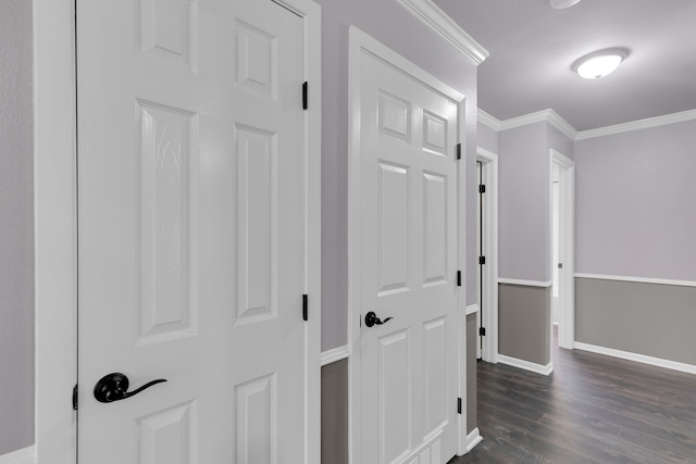 hall featuring dark hardwood / wood-style floors and ornamental molding