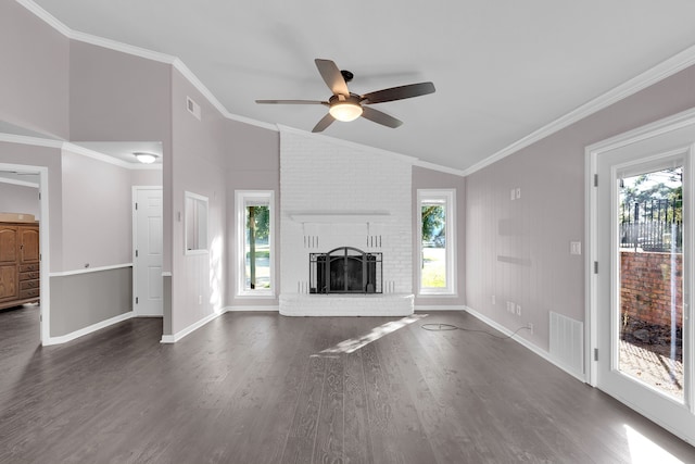 unfurnished living room featuring a fireplace, ornamental molding, a wealth of natural light, and dark wood-type flooring