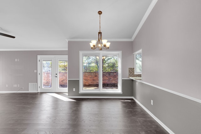 interior space with ceiling fan with notable chandelier, dark hardwood / wood-style flooring, crown molding, and french doors