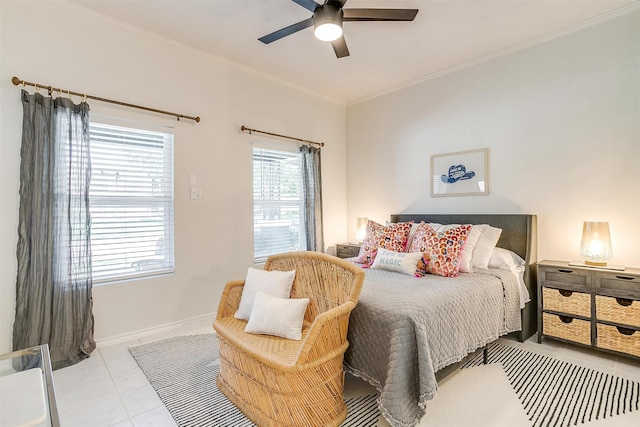 bedroom with ceiling fan, ornamental molding, and light tile patterned floors