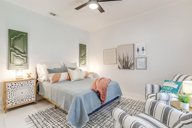 tiled bedroom featuring crown molding and ceiling fan