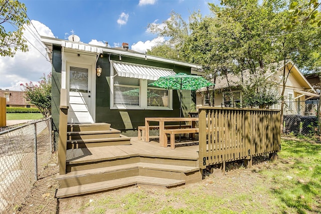 rear view of property with a deck