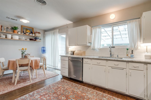 kitchen featuring dishwasher, white cabinets, dark wood-type flooring, and sink