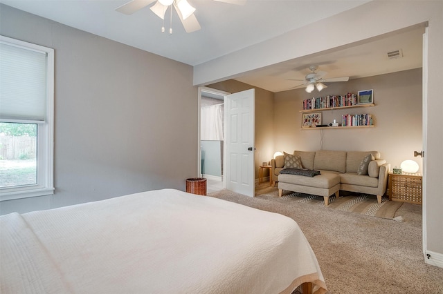 carpeted bedroom with ceiling fan