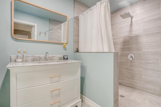 bathroom with a shower with shower curtain and vanity