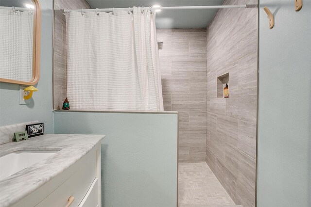 bathroom featuring vanity and walk in shower