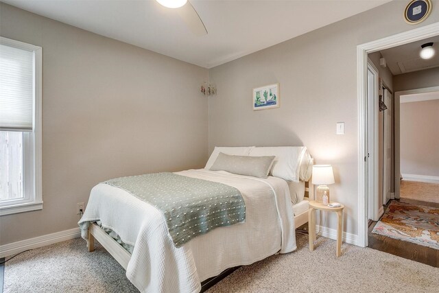 bedroom featuring wood-type flooring and ceiling fan