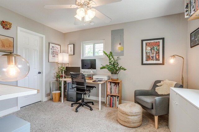 carpeted office featuring electric panel and ceiling fan