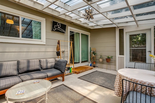 view of patio featuring an outdoor living space and a pergola