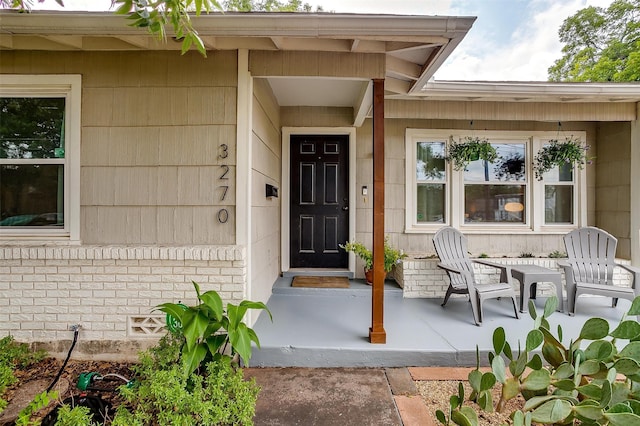 property entrance featuring a patio