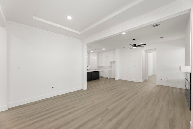 740 Wilderness Point Ln, Anna, TX 75409 - unfurnished living room featuring recessed lighting, light wood-type flooring, ceiling fan, a tray ceiling, and crown molding