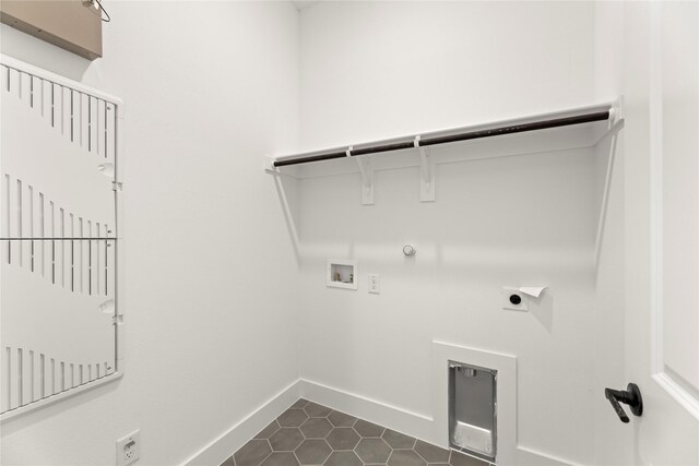 740 Wilderness Point Ln, Anna, TX 75409 - laundry area with hookup for a gas dryer, hookup for a washing machine, hookup for an electric dryer, and dark tile patterned floors