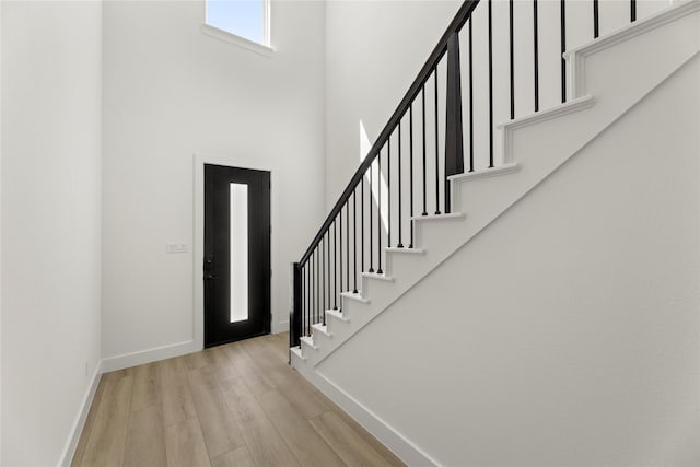 740 Wilderness Point Ln, Anna, TX 75409 - foyer featuring a high ceiling, stairs, and light wood-style floors